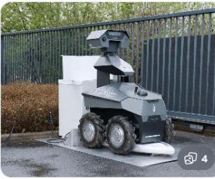 Rugged outdoor robot at a weather-exposed docking station