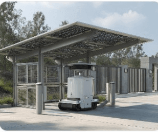 Autonomous robot docked under a solar-panel shelter outdoors